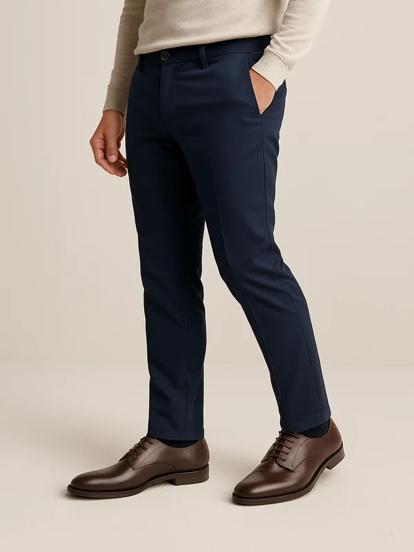 Man styling dark brown men’s shoes with navy trousers